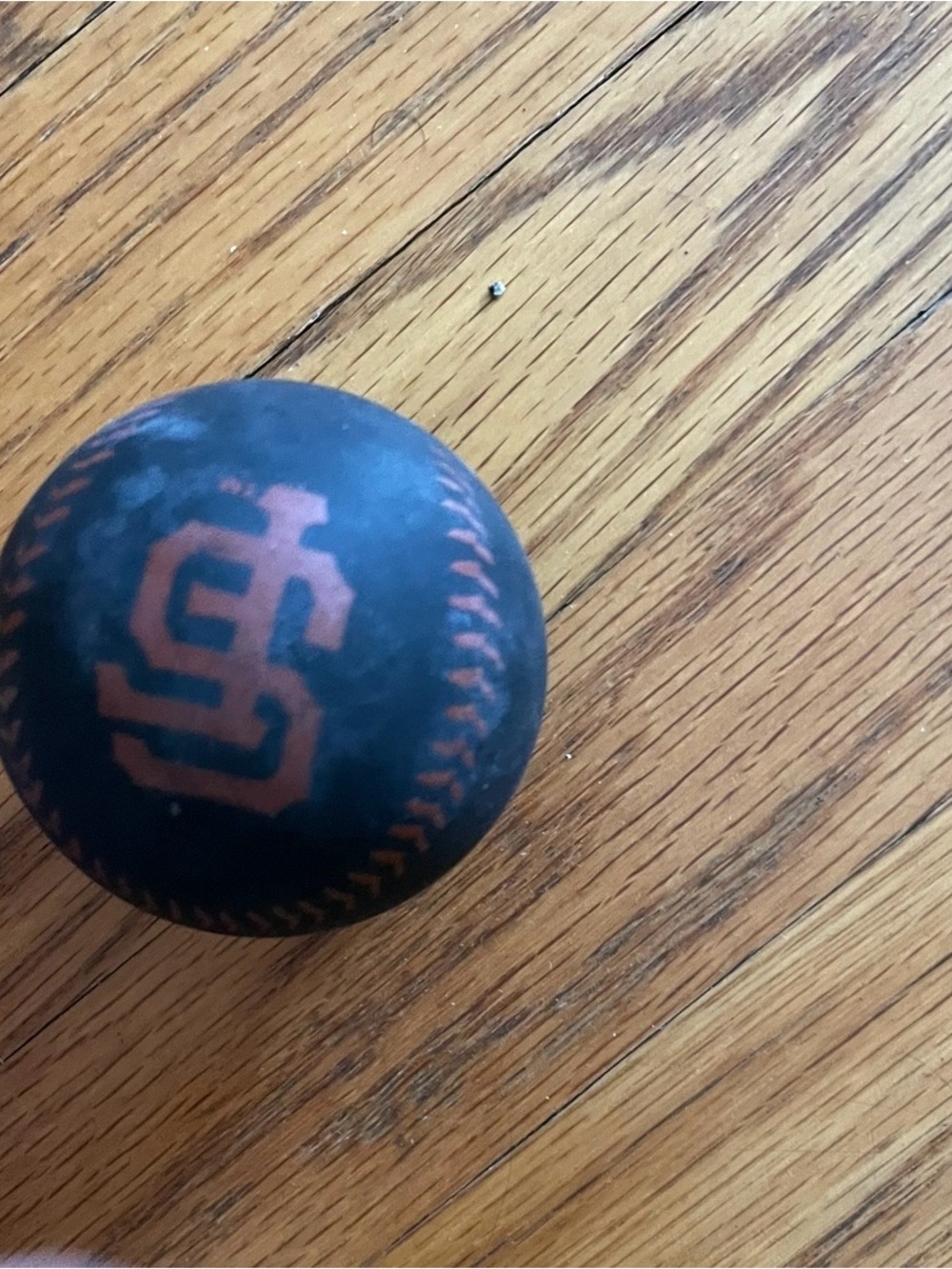 Black and Orange Baseball Stress Ball with Interlocking Logo